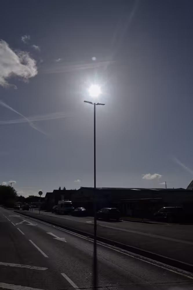 Sun above a street lamp