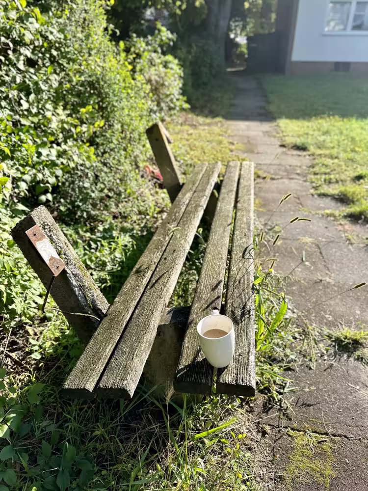 Broken bench with a coffee cup