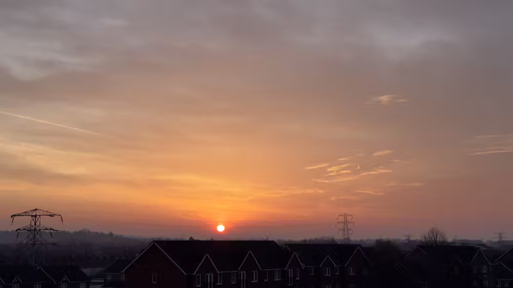 Sun rising over the rooftops