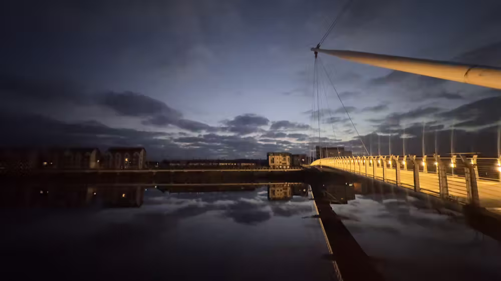 Footbridge lit up at night