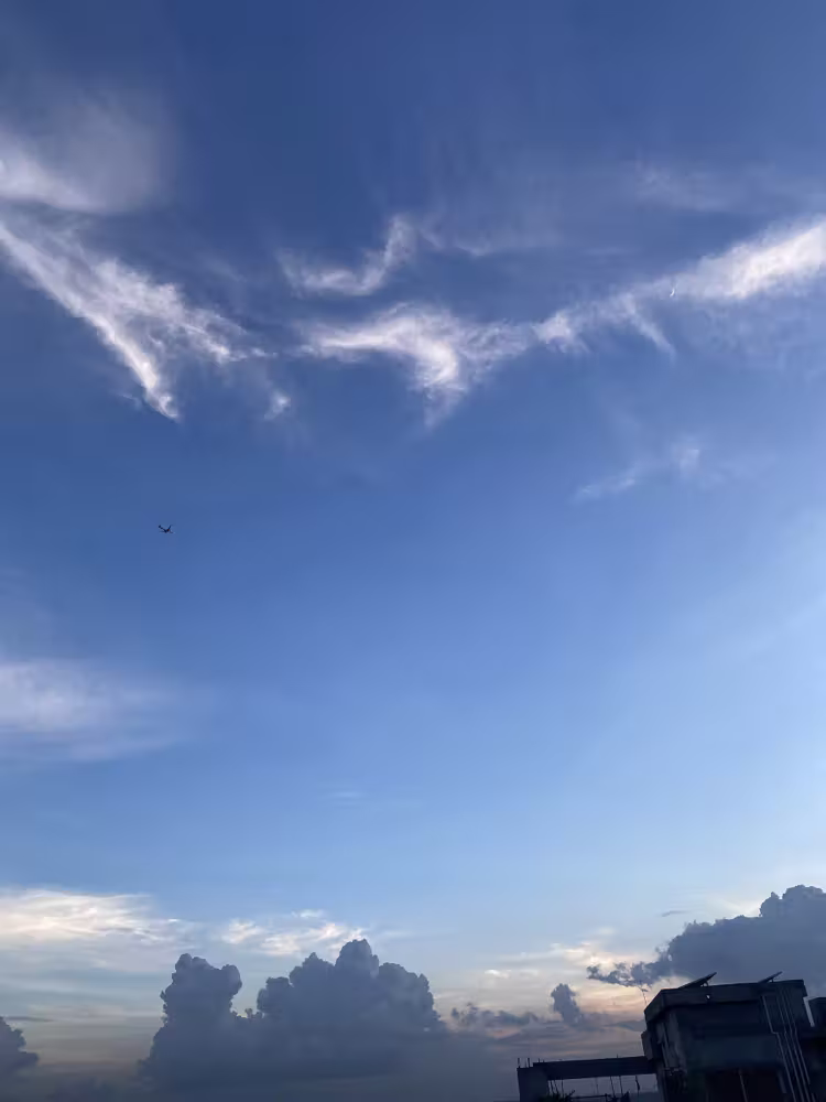 Blue sky and clouds over the rooftops