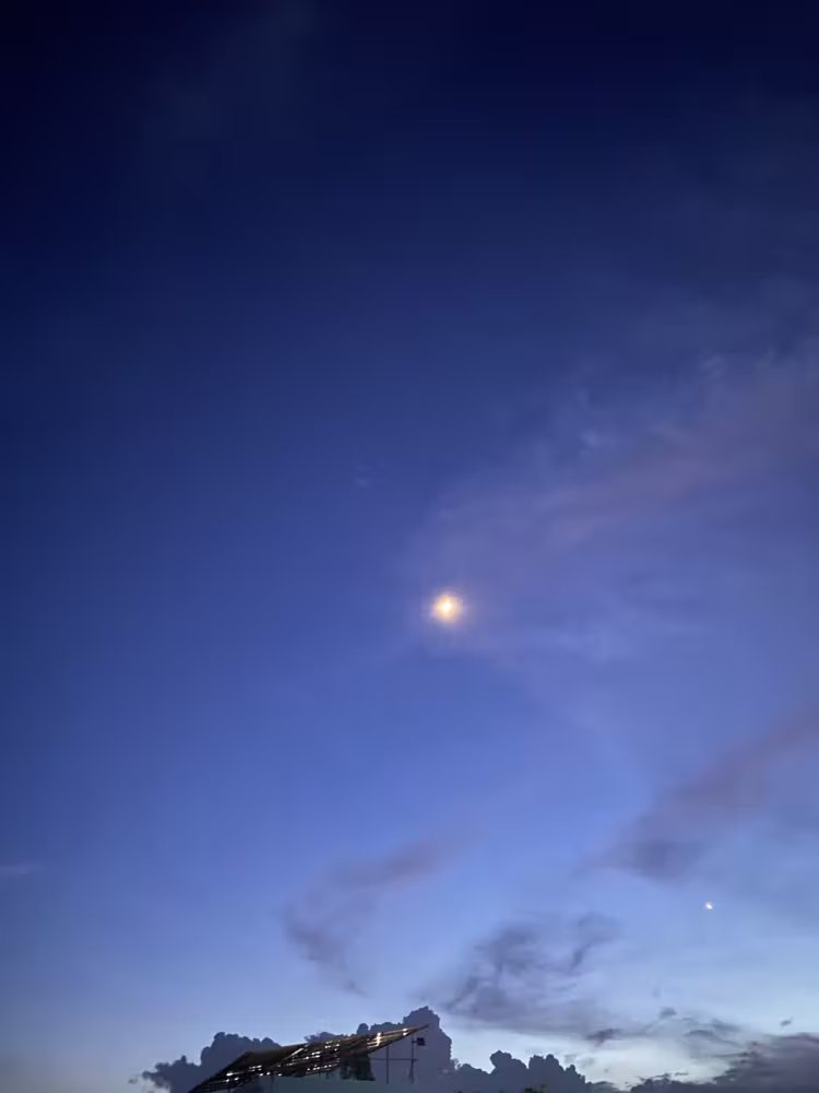 Moon in a deep blue evening sky