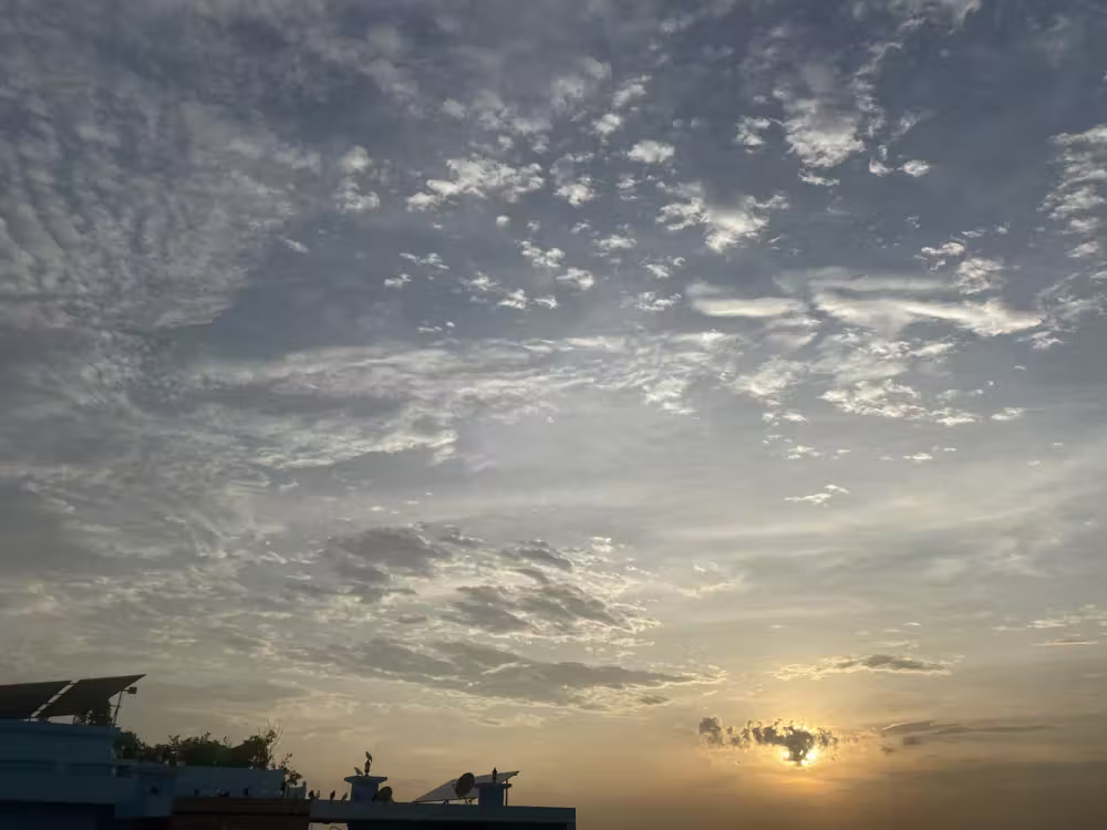 Mackerel sky at sunset over the rooftops