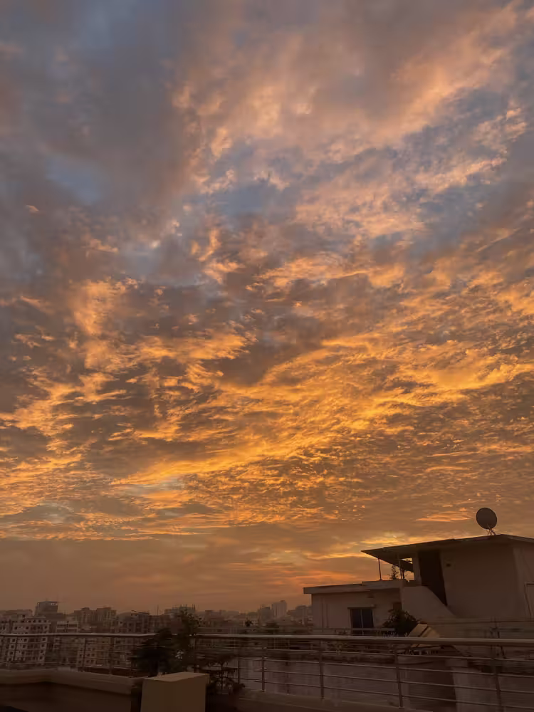 Fiery orange clouds over the rooftops