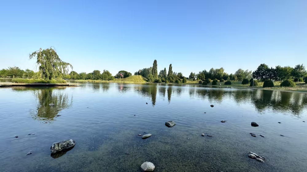 Still lake under a clear sky
